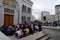 Group of men people are praying outside mosque