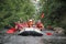 Group of men and women, enjoy water rafting activity at river. Rafting on the Pivdennyi Buh