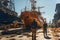 A group of men working on a dock next to a large ship in ship repair factory. Back side view. Ship building