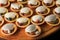 Group of mini tart shell cookies with caramel and cream filling