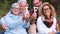 Group of mixed ages generations people smiling and showing blocks letters with  life word -  happy lifestye enjoying the outdoor l