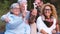 Group of mixed ages generations people smiling and showing blocks letters with  life word -  happy lifestye enjoying the outdoor l