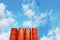 Group of Mixed Concrete Tanks Against Blue Cloudy Sky