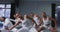 Group of mixed race fit female modern dancers practicing a dance routine