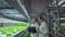 Group of modern scientists biotechnology scientist in white suit with tablet for working organic hydroponic vegetable
