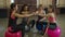 Group of motivated fitness females stacking hands
