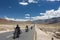 Group of motorbike tourists riding motorcycles on the Leh - Manali National highway in Ladakh, Northern India