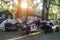 Group of motorbikes parked near a wooden house in the forest