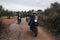 Group of motorcycle bikers on gravel dirt road