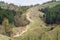 Group of mountain bikers on a steep dirt road leading to a mount