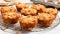 a group of muffins on a cooling rack