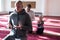 Group of muliethnic religious muslim young people  praying an dreading Koran together. Group of muslims praying in the mosque