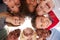 Group Of Multi-Cultural Children With Friends Looking Down Into Camera