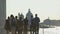 Group of multi-ethnic tourists walking in Venice, view of Grand Canal, tourism