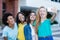 Group of multi ethnic young adult woman taking crazy selfie