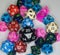 Group of multicolored dice sets with numbers on a white table