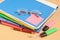 Group of multicolored office folders, glasses and office supplies