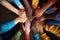 Group of multiethnic people holding hands together on dark background, closeup, A group of diverse hands together joining concept