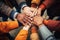 Group of multiethnic people holding hands together. Diversity concept, Team members putting hands together close-up, top view, No