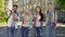 Group of multiethnic students sincerely smiling, showing thumbs-up gesture