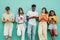 Group of multiethnic teenagers addicted to use the smartphone on blue background. Five multiracial young people or