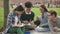 Group of multiracial college students using laptop computer.