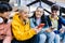 Group of multiracial teenage students using mobile phones on school