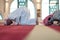 group of muslim people praying namaz in mosque.