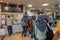 A group Muslim tourist queue at a ticket counter at Shin-imamiya-ekimae station in Osaka, Japan