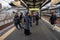 A group Muslim tourist wait for train at Shin-imamiya-ekimae station in Osaka, Japan