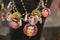 Group of Necklaces with Coloured Beads and Frida Kahlo Effigy hanging on a Display Unit