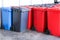 Group of new large colorful wheelie bins for rubbish, recycling waste