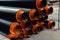 Group of new metal industrial pipes for water outside, pipeline for urban construction, sewage or heat supply.