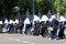 A group of nuns in church clothes are walking down street in city Kyiv. Religious women, parishioners of the Orthodox Church walk