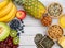 Group Nuts on the bowl and fruit is banana,pineapple and grape is food healthy on the wooden table background