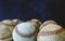 Group of old baseballs close up on blue background