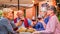 Group of old people eating and drinking outdoor - Senior couples having fun together