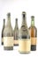 Group of old vintage bottles of wine completely dusty