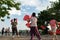 Group of old women dancing with fan for excercise in early morning in Hanoi, Vietnam