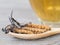 Group of Ophiocordyceps sinensis or mushroom cordyceps this is a herbs placed on wooden spoon in front of a glass of cordyceps wat