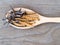 Group of Ophiocordyceps sinensis or mushroom cordyceps this is a herbs placed on wooden spoon on wooden background. on wooden tabl