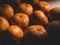 group of orange fruit under sunlight, close up shot, low saturation, matte tone