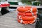 Group orange lifebuoy on wooden resort lake pier