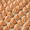 Group of orange meringues, close up shot. Airy sweets in form of drop, fresh from oven. Delicate dessert, egg sweets or