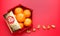 Group of orange tangerine in Chinese pattern tray and golden envelope packet ang pow with gold ingots on red table top. Chinese n