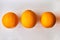 A group of oranges on a table
