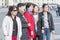 Group of Oriental women, tourists from Asia posing for photos at the Palace square of St. Petersburg, Russia, 2018