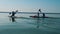 Group of paddlers are rowing along the lake waters