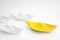 Group of paper boats following yellow one on white background, above view. Leadership concept