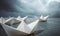 Group of paper boats sailing in open ocean